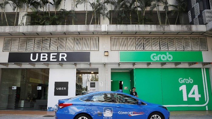 Uber di Asia Tenggara telah dibeli Grab. Foto: Reuters Uber di Asia Tenggara telah dibeli Grab. Foto: Reuters