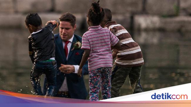 Foto Heroik Pengantin Pria ini Selamatkan Bocah Foto Heroik Pengantin Pria ini Selamatkan Bocah