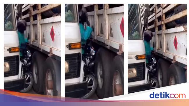 Motorbike Trapped Between Two Trucks: Be Careful Riding Near Large Vehicles