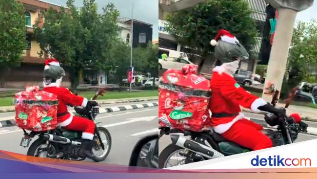 Keren! Ojol Meriahkan Natal, Antar Makanan Pakai Kostum Santa Claus