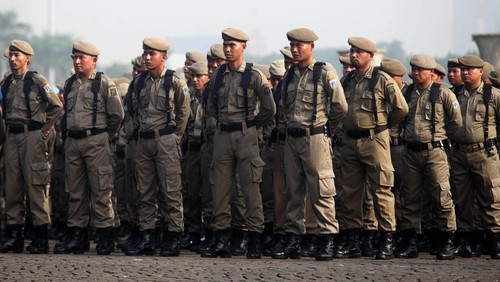 Acara HUT Satpol PP di Monas, Jakarta Pusat, Kamis (27/3/2014). 3.600 personil gabungan Satpol PP serta instansi terkait mengikuti apel tersebut.