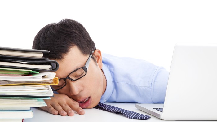 young businessman too weary to asleep