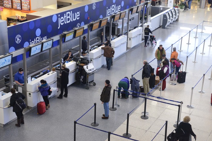BOSTON, MA - JANUARY 7: JetBlue passengers stand in thin lines while waiting for normal flights to resume later this afternoon in Terminal C at Logan International Airport January 7, 2014 in Boston, Massachusetts. On Monday JetBlue canceled nearly all operations into Bostons Logan, as well as New Yorks John F. Kennedy International and LaGuardia, and New Liberty International in New Jersey, blaming a weekend of bad weather, and new Federal Aviation Administration rules on pilot duty times. (Photo by Darren McCollester/Getty Images)