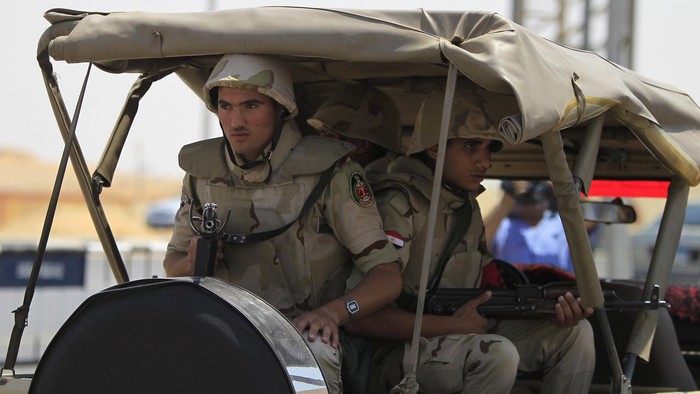 Soldiers secure the funeral of Egyptian public prosecutor Hisham Barakat on the second anniversary of the June 30 protests that toppled President Mohamed Mursi, in Cairo, Egypt, June 30, 2015. REUTERS/Mohamed Abd El Ghany