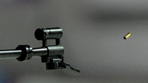 A shot is fired by Canadas Zina Kocher as she competes in the Womens Biathlon 4x6 km Relay at the Laura Cross-Country Ski and Biathlon Center during the Sochi Winter Olympics on February 21, 2014, in Rosa Khutor, near Sochi.  AFP PHOTO / KIRILL KUDRYAVTSEV        (Photo credit should read KIRILL KUDRYAVTSEV/AFP/Getty Images)