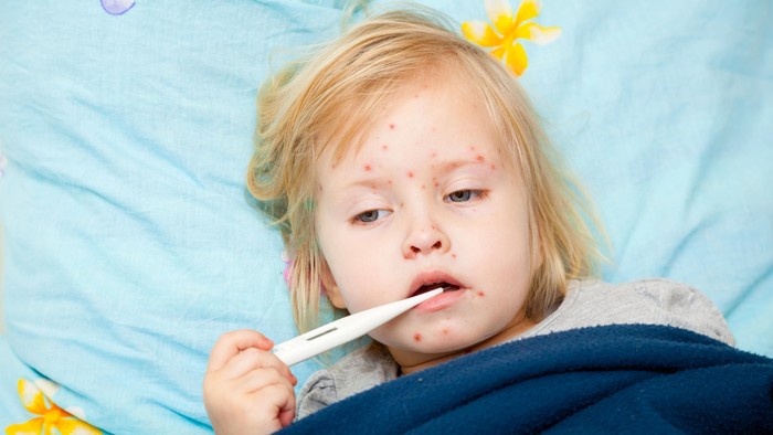 The doctor gave children vaccination needle