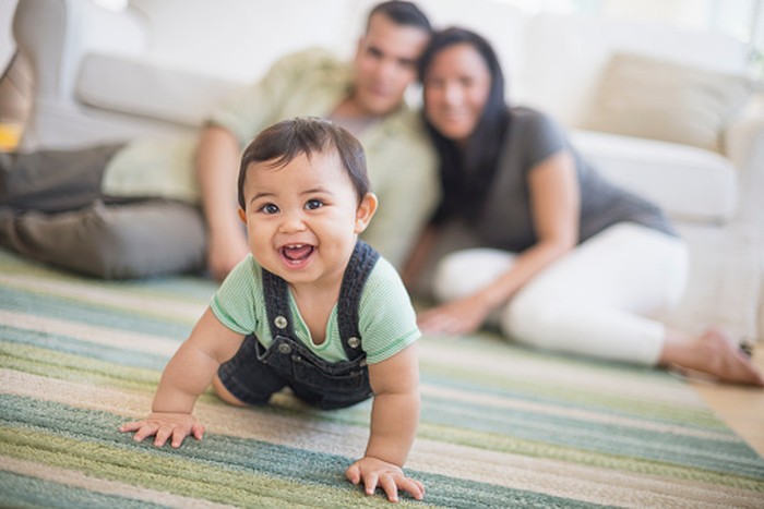 USA, New Jersey, Jersey City, Family with baby son (6-11 months) in living room