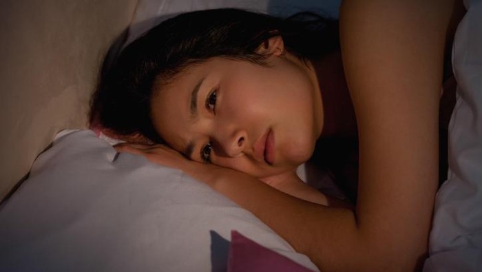 Insomnia Seorang perempuan mengalami insomnia.