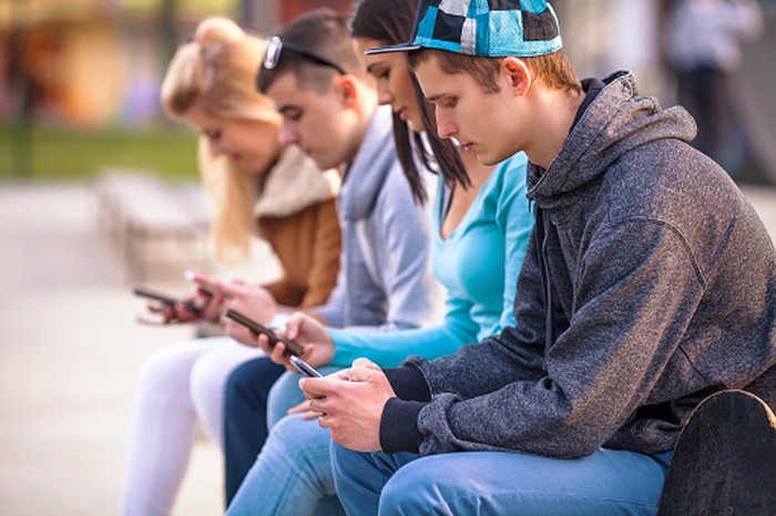 Teenagers Using Mobile Phones