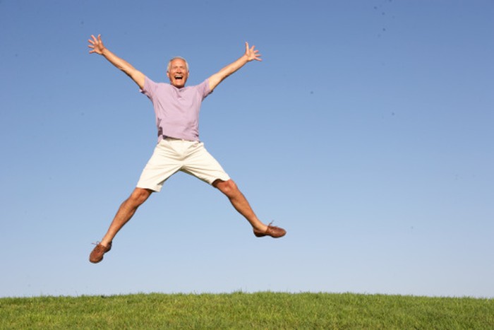 Senior man jumping in air