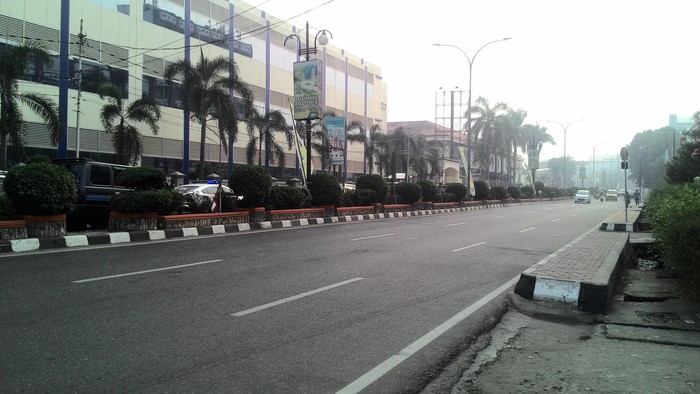 Kabut Asap di Palembang Hilang, Warga Lepas Masker
