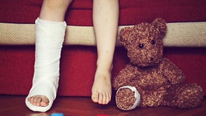 boys foot in cast, teddy bears foot bandaged