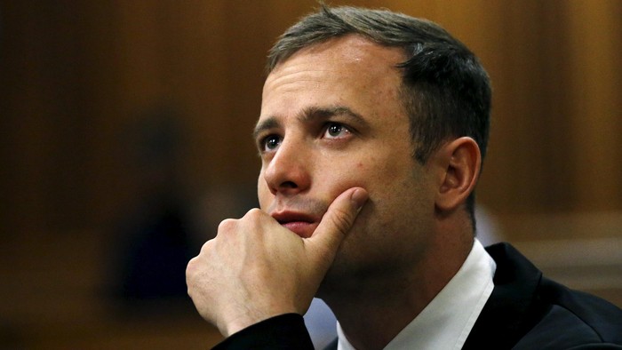 Olympic and Paralympic track star Oscar Pistorius is pictured ahead of his sentencing hearing at the North Gauteng High Court in Pretoria in this October 16, 2014 file photo. Pistorius will be released on parole on Oct. 20, about a year into his five-year sentence for killing his girlfriend Reeva Steenkamp, authorities said. The department of correctional services said in a statement on October 15, 2015 the Olympic and Paralympic track star would be placed under house arrest from Tuesday. REUTERS/Siphiwe Sibeko/Files      TPX IMAGES OF THE DAY