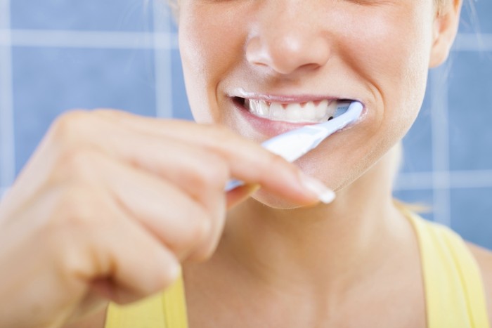 Woman brushing her teeth