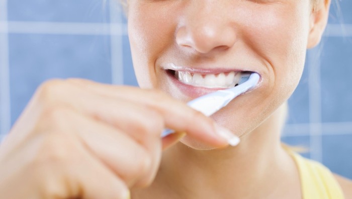 Woman brushing her teeth