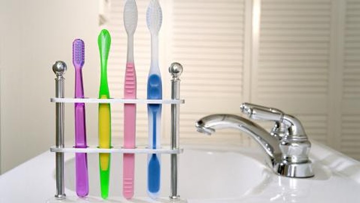Toothbrushes on sink