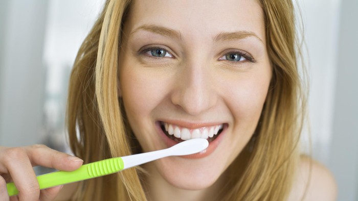 Woman brushing her teeth