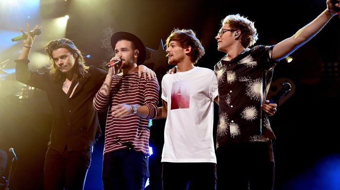 DALLAS, TX - DECEMBER 01:  (L-R) Singers Harry Styles, Liam Payne, Louis Tomlinson and Niall Horan of musical group One Direction perform onstage during 106.1 KISS FMs Jingle Ball 2015 presented by Capital One at American Airlines Center on December 1, 2015 in Dallas, Texas.  (Photo by Kevin Winter/Getty Images for iHeartMedia)