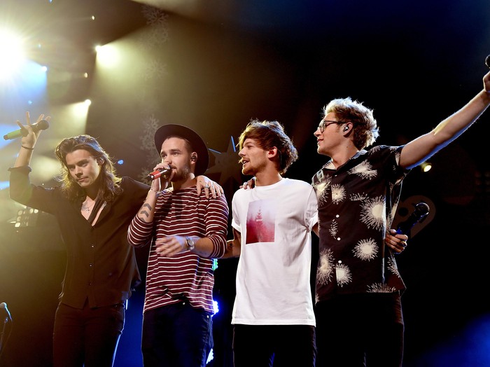 DALLAS, TX - DECEMBER 01:  (L-R) Singers Harry Styles, Liam Payne, Louis Tomlinson and Niall Horan of musical group One Direction perform onstage during 106.1 KISS FMs Jingle Ball 2015 presented by Capital One at American Airlines Center on December 1, 2015 in Dallas, Texas.  (Photo by Kevin Winter/Getty Images for iHeartMedia)