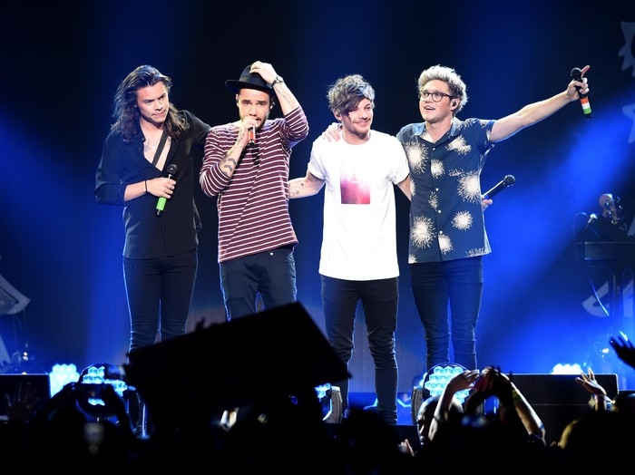 DALLAS, TX - DECEMBER 01:  (L-R) Singers Harry Styles, Liam Payne, Louis Tomlinson and Niall Horan of musical group One Direction perform onstage during 106.1 KISS FMs Jingle Ball 2015 presented by Capital One at American Airlines Center on December 1, 2015 in Dallas, Texas.  (Photo by Kevin Winter/Getty Images for iHeartMedia)