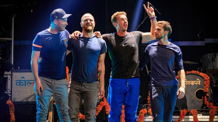(L-R) Guitarist Jonny Buckland, drummer Will Champion, frontman Chris Martin and bassist Guy Berryman of Coldplay take a bow after performing onstage at the 2015 iHeartRadio Music Festival at MGM Grand Garden Arena on September 18, 2015 in Las Vegas, Nevada. (Photo by Christopher Polk/Getty Images for iHeartMedia)
