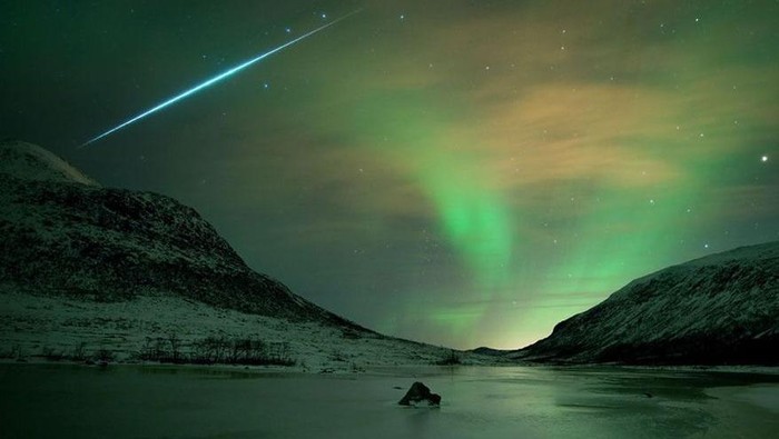 Natures light show is how NASA describes the Geminid meteor shower  a meteor flash is seen here with an aurora borealis shimmer in Norway. (nasa.gov)