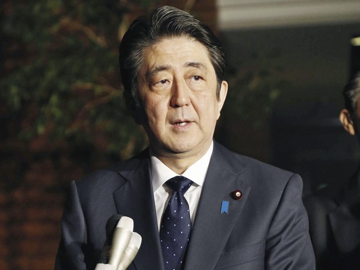 Japanese Prime Minister Shinzo Abe speaks to reporters after South Korea and Japan reached an agreement on 