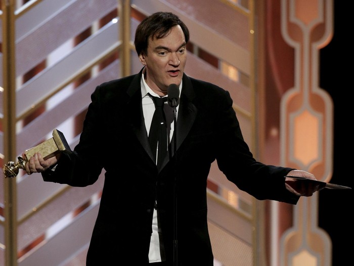 Quentin Tarantino accepts the award for Ennio Morricone after The Hateful Eight won Best Original Score - Motion Picture at the 73rd Golden Globe Awards in Beverly Hills, California January 10, 2016. REUTERS/Paul Drinkwater/NBC Universal/Handout For editorial use only. Additional clearance required for commercial or promotional use. Contact your local office for assistance. Any commercial or promotional use of NBCUniversal content requires NBCUniversals prior written consent. No book publishing without prior approval.