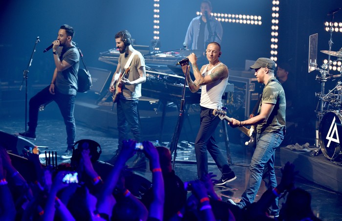 BURBANK, CA - JUNE 18:  Musical group Linkin Park onstage during the iHeartRadio album release party with Linkin Park presented by Clear Channel at the iHeartRadio Theater on June 18, 2014 in Burbank, California.  (Photo by Kevin Winter/Getty Images for Clear Channel)