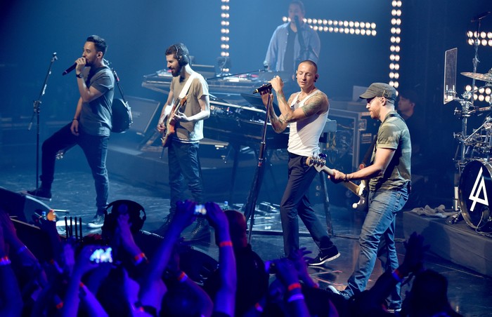 489363861PB00108_Linkin_Par BURBANK, CA - JUNE 18: Musical group Linkin Park onstage during the iHeartRadio album release party with Linkin Park presented by Clear Channel at the iHeartRadio Theater on June 18, 2014 in Burbank, California. (Photo by Kevin Winter/Getty Images for Clear Channel)
