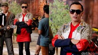 Ia memadukan jaketnya itu dengan kaus merah, celana hitam dan sneakers merah. Pool/Ismail/detikFoto.