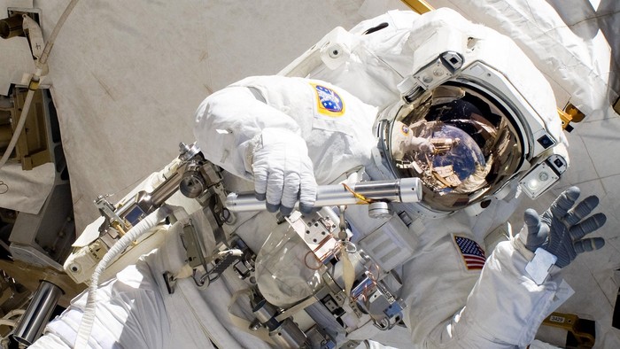 IN SPACE - FEBRUARY 28:  In this handout image provided by NASA, NASA astronaut Alvin Drew waves as he participates in the missions first session of extravehicular activity (EVA) as construction and maintenance continue on the International Space Station February 28, 2011 in Space. During the six-hour, 34-minute spacewalk, Steve Bowen and Drew installed the J612 power extension cable, move a failed ammonia pump module to the External Stowage Platform 2 on the Quest Airlock for return to Earth at a later date, installed a camera wedge on the right hand truss segment, installed extensions to the mobile transporter rail and exposed the Japanese 