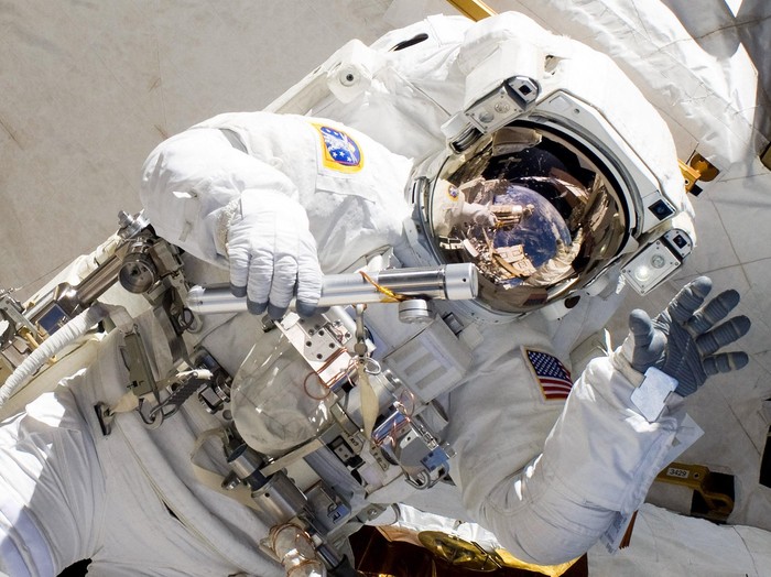 IN SPACE - FEBRUARY 28:  In this handout image provided by NASA, NASA astronaut Alvin Drew waves as he participates in the missions first session of extravehicular activity (EVA) as construction and maintenance continue on the International Space Station February 28, 2011 in Space. During the six-hour, 34-minute spacewalk, Steve Bowen and Drew installed the J612 power extension cable, move a failed ammonia pump module to the External Stowage Platform 2 on the Quest Airlock for return to Earth at a later date, installed a camera wedge on the right hand truss segment, installed extensions to the mobile transporter rail and exposed the Japanese 