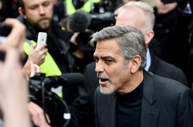 EDINBURGH, SCOTLAND - NOVEMBER 12:  Hollywood actor George Clooney, meets members of the public during  a visit to Social Bite sandwich shop which helps homeless people on November 12, 2015 in Edinburgh,Scotland. The actor visited the Social Bite cafe, which donates all its profits to homeless people, he will also have lunch with a competition winner and address the Scottish Business awards this evening.  (Photo by Jeff J Mitchell/Getty Images)