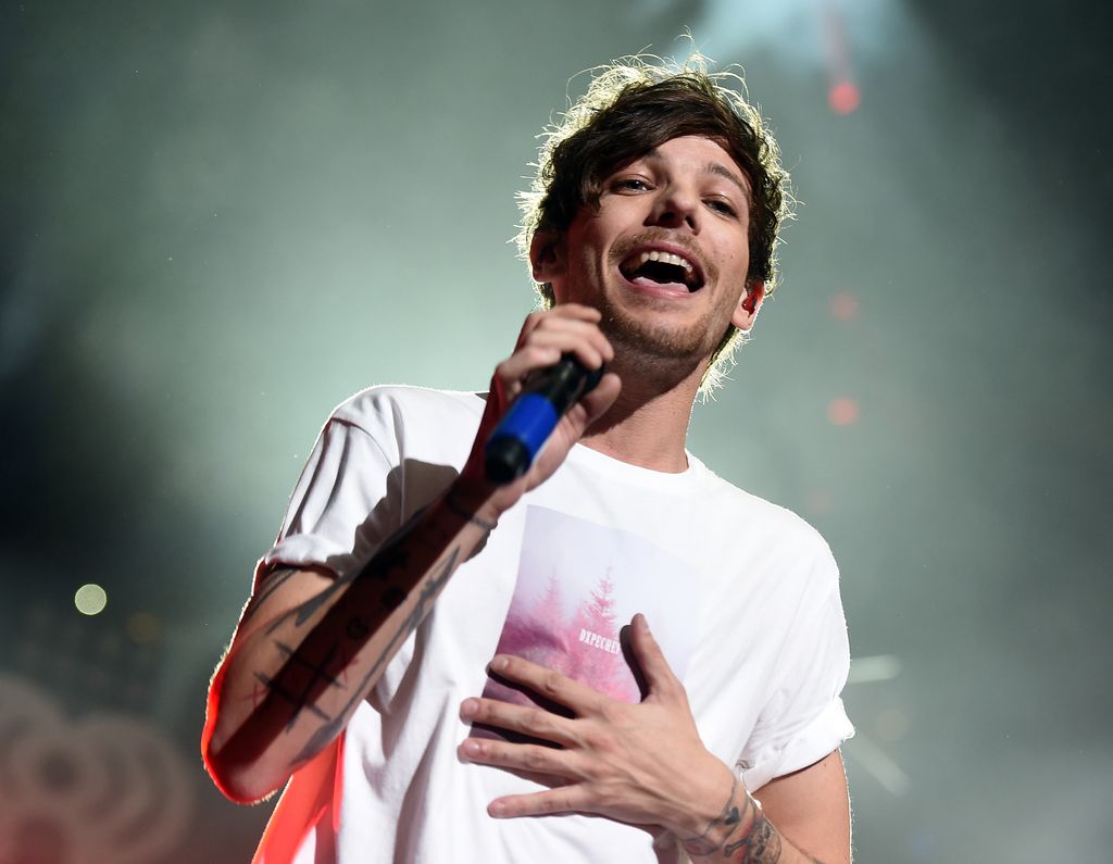 DALLAS, TX - DECEMBER 01:  Singer Louis Tomlinson of musical group One Direction performs onstage during 106.1 KISS FM's Jingle Ball 2015 presented by Capital One at American Airlines Center on December 1, 2015 in Dallas, Texas.  (Photo by Kevin Winter/Getty Images for iHeartMedia)