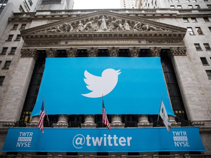 NEW YORK, NY - NOVEMBER 07:  The Twitter logo is displayed on a banner outside the New York Stock Exchange (NYSE) on November 7, 2013 in New York City. Twitter goes public on the NYSE today and is expected to open at USD 26 per share, making the company worth an estimated USD 18 billion.  (Photo by Andrew Burton/Getty Images)