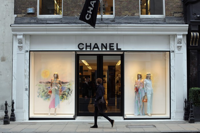 LONDON, ENGLAND - JANUARY 24:  A person walks by the Chanel store on Bond Street on January 24, 2011 in London, England. Despite the expected retail slump, sales of luxury goods are booming, with many companies posting large profits.  (Photo by Dan Kitwood/Getty Images)