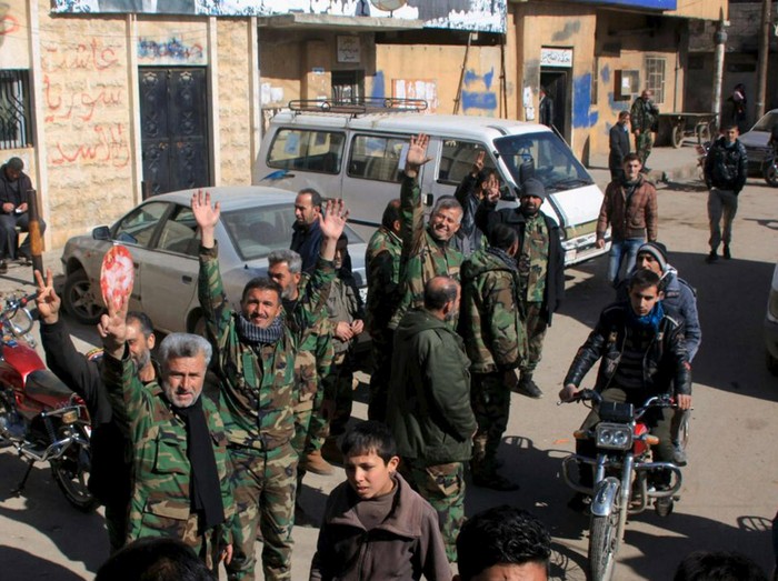 Fighters loyal to Syrias President Bashar al-Assad celebrate with residents of Nubul and al-Zahraa after breaking the siege of their towns, northern Aleppo countryside, Syria, in this handout picture provided by SANA on February 4, 2016. REUTERS/SANA/Handout via Reuters ATTENTION EDITORS - THIS PICTURE WAS PROVIDED BY A THIRD PARTY. REUTERS IS UNABLE TO INDEPENDENTLY VERIFY THE AUTHENTICITY, CONTENT, LOCATION OR DATE OF THIS IMAGE. FOR EDITORIAL USE ONLY. NOT FOR SALE FOR MARKETING OR ADVERTISING CAMPAIGNS. THIS PICTURE IS DISTRIBUTED EXACTLY AS RECEIVED BY REUTERS, AS A SERVICE TO CLIENTS