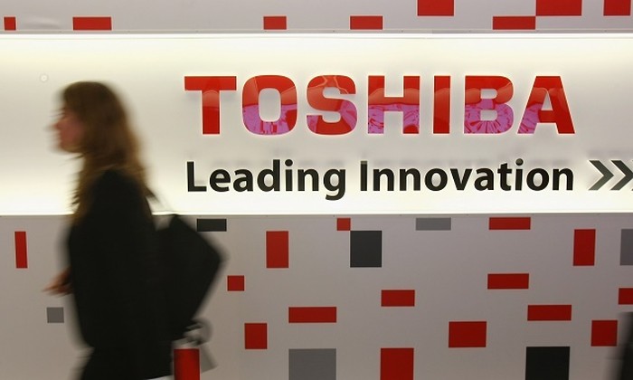 BERLIN - AUGUST 29:  Visitors walk through the Toshiba stand at the IFA consumer electronics trade fair on August 29, 2008 in Berlin, Germany. IFA opened its doors to the public today and will be open through September 3.  (Photo by Sean Gallup/Getty Images)