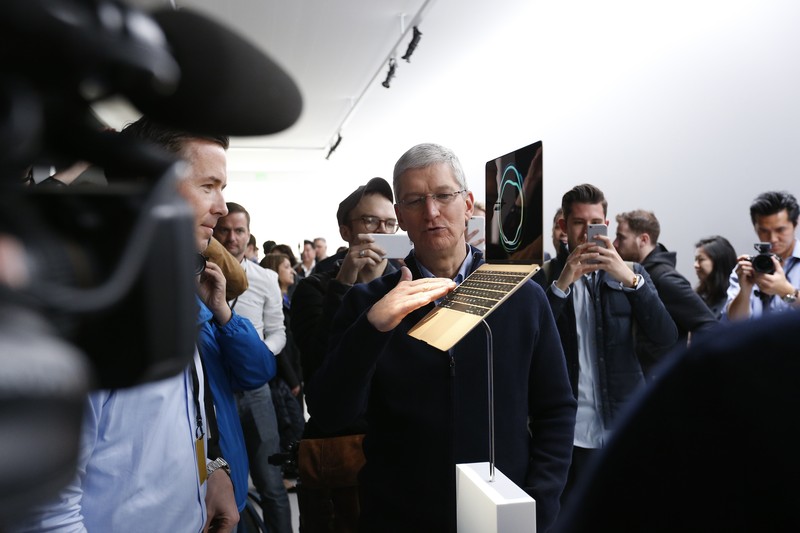 SAN FRANCISCO, CA - MARCH 9: Apple CEO Tim Cook stands in front of an MacBook on display after an Apple special event at the Yerba Buena Center for the Arts on March 9, 2015 in San Francisco, California. Apple Inc. announced the new MacBook as well as more details on the much anticipated Apple Watch, the tech giant's entry into the rapidly growing wearable technology segment as well (Photo by Stephen Lam/Getty Images)