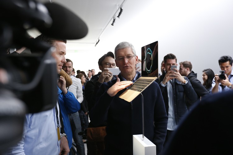 SAN FRANCISCO, CA - MARCH 9: Apple CEO Tim Cook stands in front of an MacBook on display after an Apple special event at the Yerba Buena Center for the Arts on March 9, 2015 in San Francisco, California. Apple Inc. announced the new MacBook as well as more details on the much anticipated Apple Watch, the tech giants entry into the rapidly growing wearable technology segment as well (Photo by Stephen Lam/Getty Images)