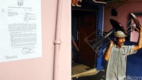 Surat Peringatan (SP1) tertempel di salah satu dinding diskotek. SP1 itu memberi waktu 7x24 jam bagi warga untuk mengosongkan/membongkar sendiri bangunan yang mereka tempati.