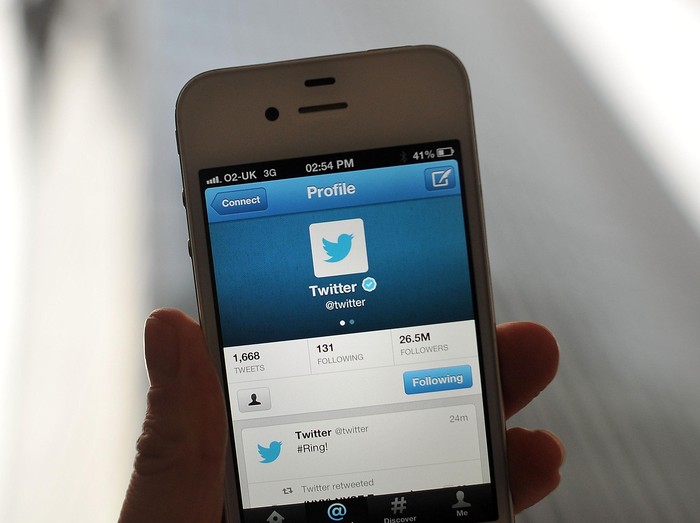 LONDON, ENGLAND - NOVEMBER 07:  In this photo illustration, the Twitter logo and hashtag #Ring! is displayed on a mobile device as the company announced its initial public offering and debut on the New York Stock Exchange on November 7, 2013 in London, England. Twitter went public on the NYSE opening at USD 26 per share, valuing the companys worth at an estimated USD 18 billion.  (Photo by Bethany Clarke/Getty Images)