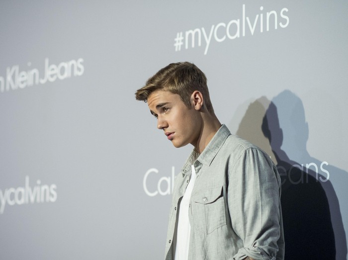 HONG KONG - JUNE 11:   Justin Bieber poses on the red carpet at the Calvin Klein Jeans music event with special appearance from Justin Bieber and performances by Jay Park, Kevin Poon, Joon & Verbal at the Kai Tak Cruise Terminal, Hong Kong, Thursday, June 11, 2015.  (Photo by Victor Fraile/Getty Images)