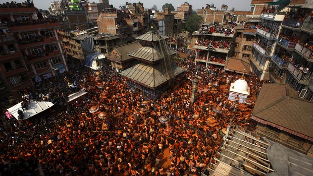 Devotees carry a chariot as they celebrate the 