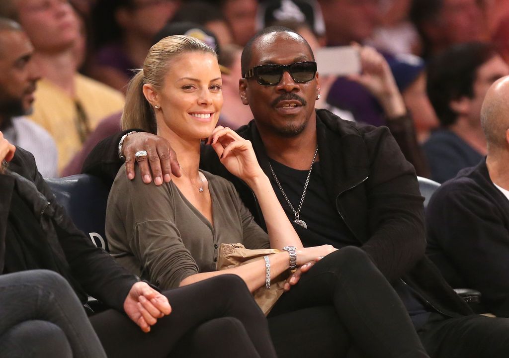 LOS ANGELES, CA - APRIL 12: Eddie Murphy and girlfriend Paige Butcher attend the game between the Dallas Mavericks and the Los Angeles Lakers at Staples Center on April 12, 2015 in Los Angeles, California.  The Mavericks won 120-106. NOTE TO USER: User expressly acknowledges and agrees that, by downloading and or using this photograph, User is consenting to the terms and conditions of the Getty Images License Agreement.  (Photo by Stephen Dunn/Getty Images)
