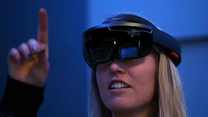 SAN FRANCISCO, CA - MARCH 30:  Microsoft employee Gillian Pennington demonstrates the Microsoft HoloLens augmented reality (AR) viewer during the 2016 Microsoft Build Developer Conference on March 30, 2016 in San Francisco, California. The Microsoft Build Developer Conference runs through April 1.  (Photo by Justin Sullivan/Getty Images)
