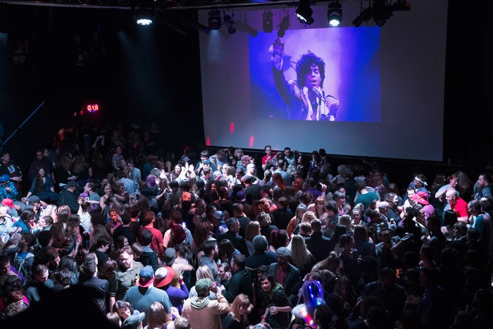 Prince MINNEAPOLIS, MN - APRIL 21: People listen to Prince music during a memorial street party outside the First Avenue nightclub on April 21, 2016 in Minneapolis, Minnesota. Prince, 57, was pronounced dead shortly after being found unresponsive today at Paisley Park Studios in Chanhassen, Minnesota near Minneapolis. (Photo by Scott Olson/Getty Images)