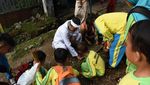 Bupati Dedi Bersih-bersih Lingkungan di Hardiknas