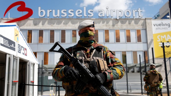 A Belgian soldier stands guard outside the partially reopened departure hall of Zaventem international airport near Brussels, Belgium, May 3, 2016. REUTERS/Francois Lenoir     TPX IMAGES OF THE DAY